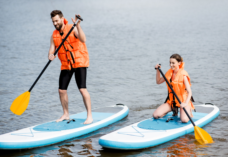 couple stand up paddle boarding